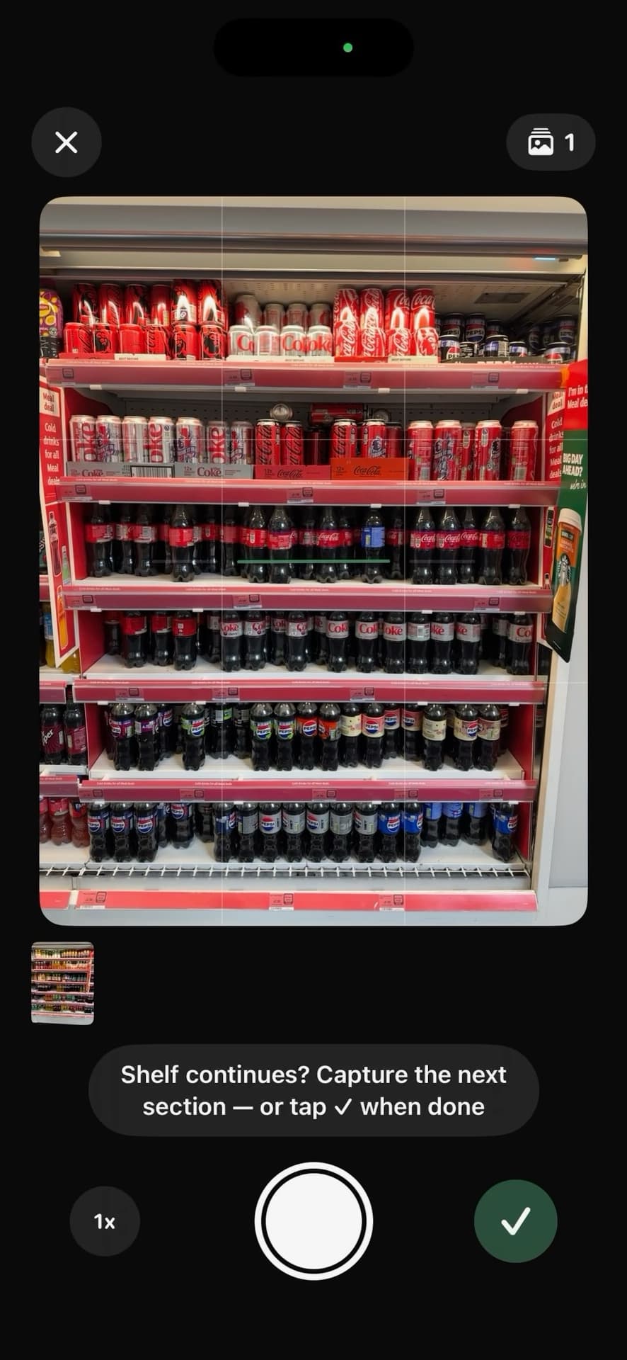 Capture screen: the camera framing a supermarket drinks fridge, prompting to capture the next section or finish